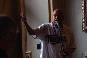 Robert Grace '98 addresses the Auggies.